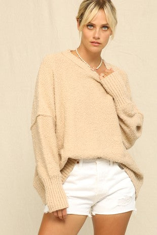 TAN SWEATER FEATURING EXPOSED SEAM DETAILING