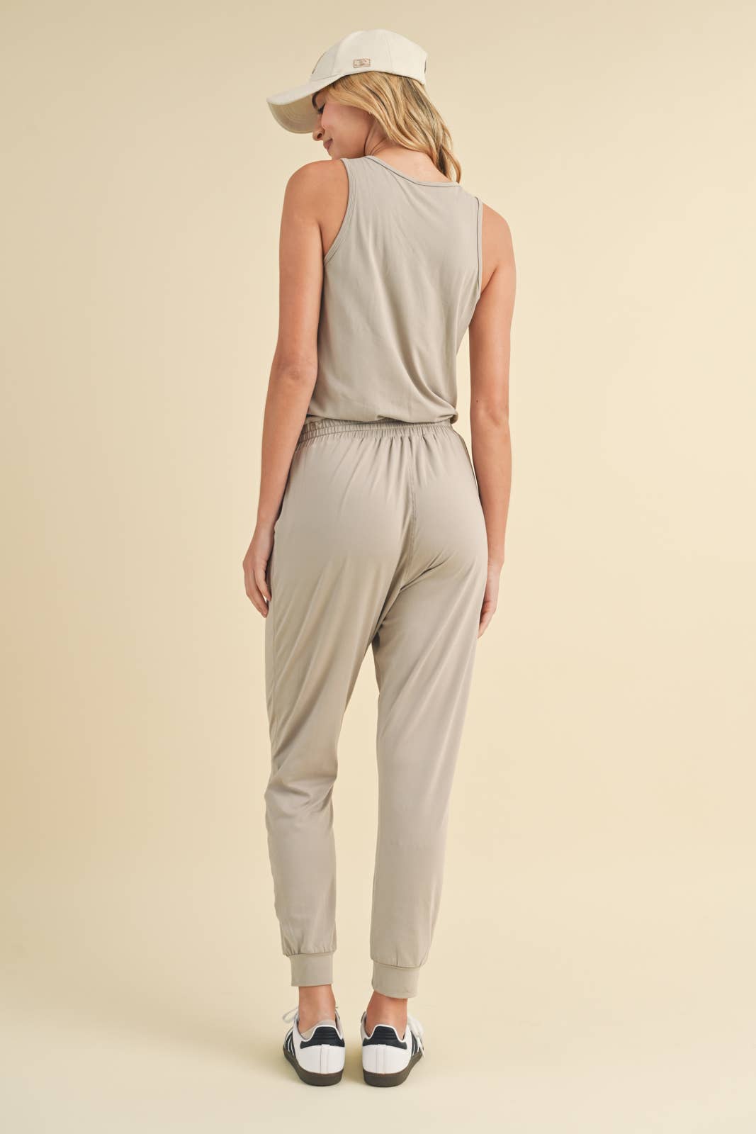 SOFT TOUCH KNIT JUMPSUIT WITH DRAWSTRING-CEMENT