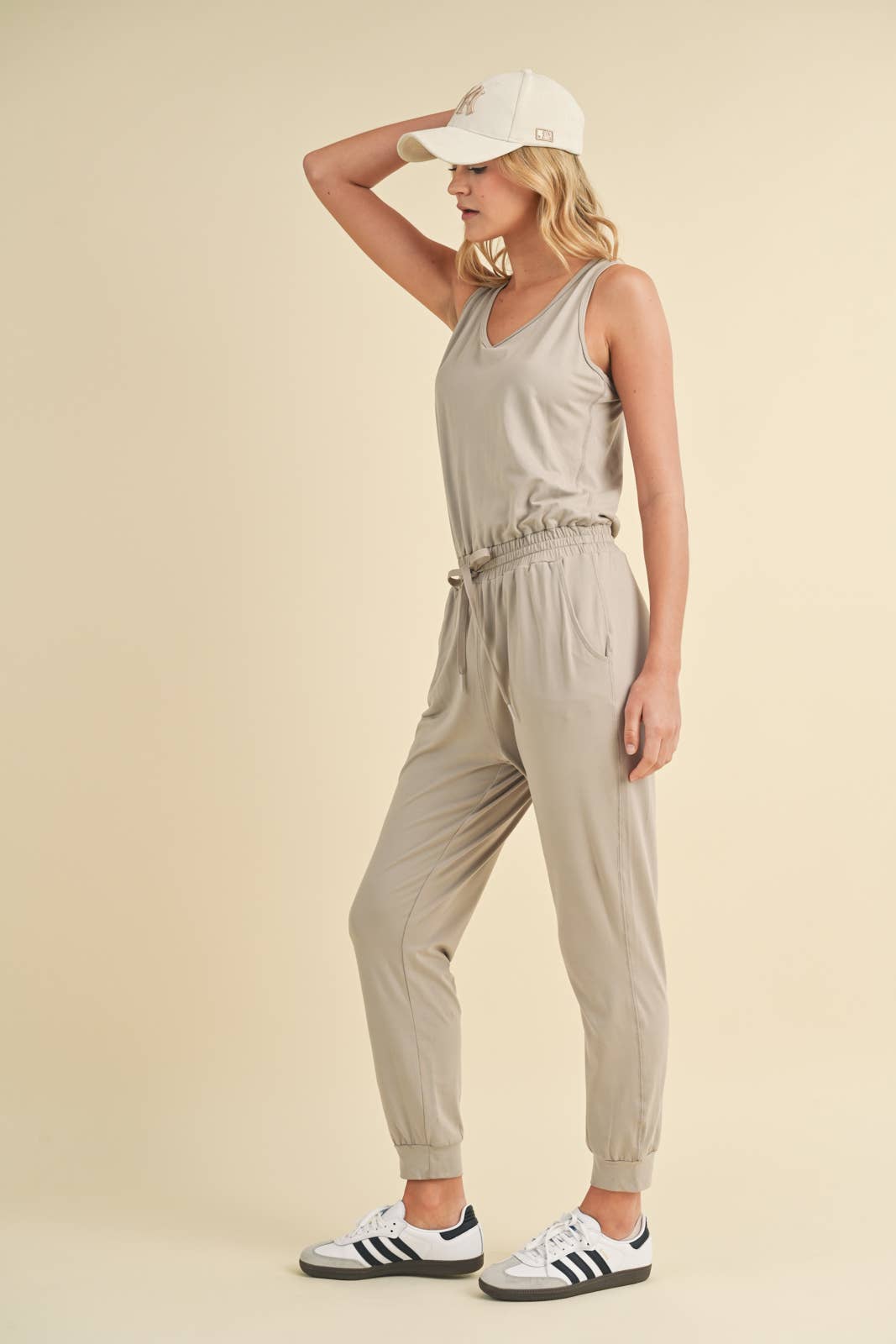 SOFT TOUCH KNIT JUMPSUIT WITH DRAWSTRING-CEMENT