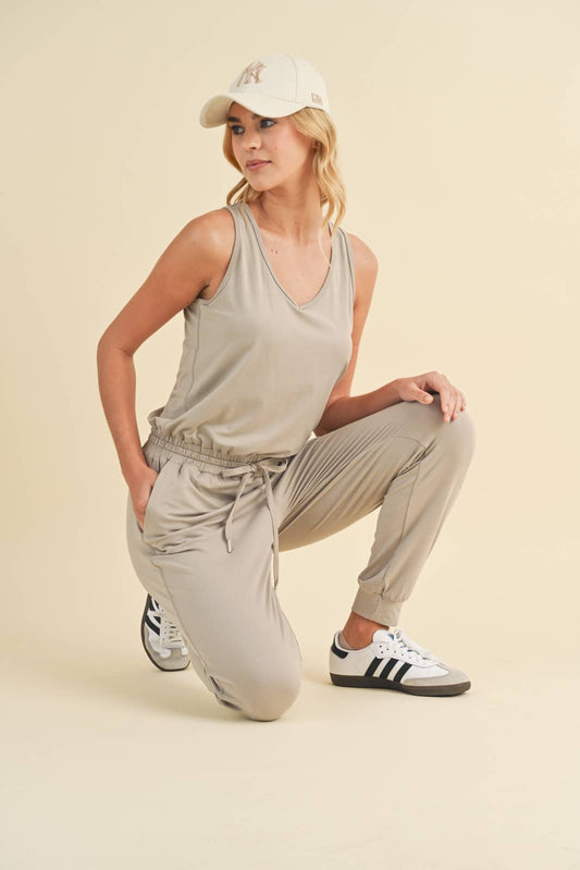 SOFT TOUCH KNIT JUMPSUIT WITH DRAWSTRING-CEMENT